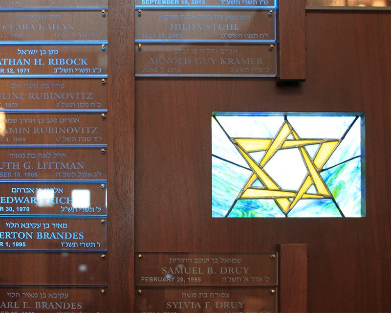DSA Signage LED Light Panels illuminating stained glass panes inset in a wood memorial board for Temple Emunah in Lexington, VA