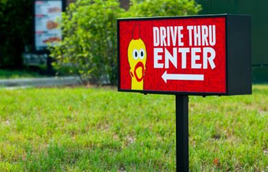 Custom drive-thru signage accessories for restaurant drive lanes